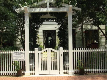 This charming gate incorporates an arbor, adding to its good looks and usefulness.  Photo by Al Smoczynski