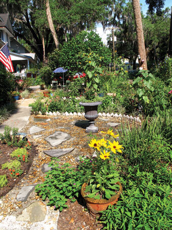 Pebble-and-flagstone patios give structure to the garden.  Photo by Ana Eire