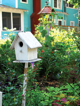 Birdhouses and other ornamentals add focal points to mixed plantings.  Photo by Ana Eire